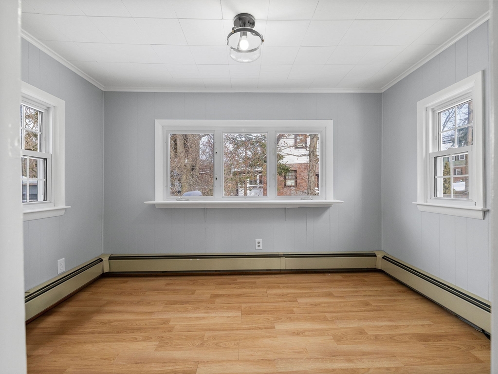 7 Neillian Crescent Boston, MA 02130 - Photo 14 of 29 a view of a room with wooden floor and window