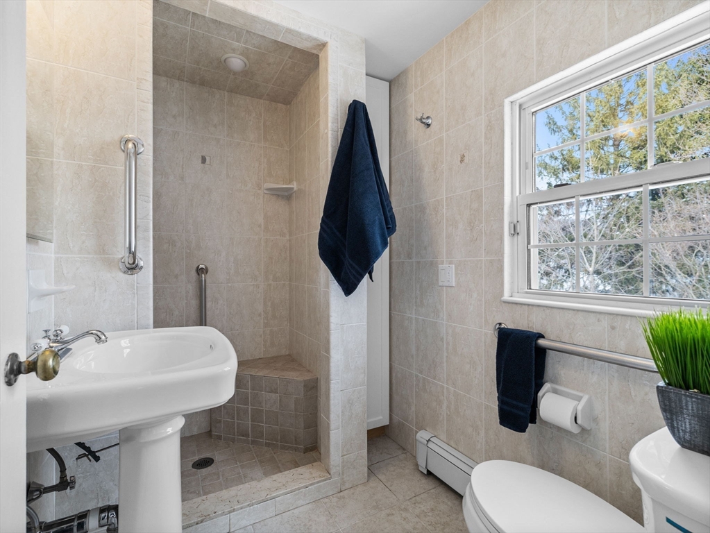 7 Neillian Crescent Boston, MA 02130 - Photo 18 of 29 a bathroom with a sink toilet and a mirror