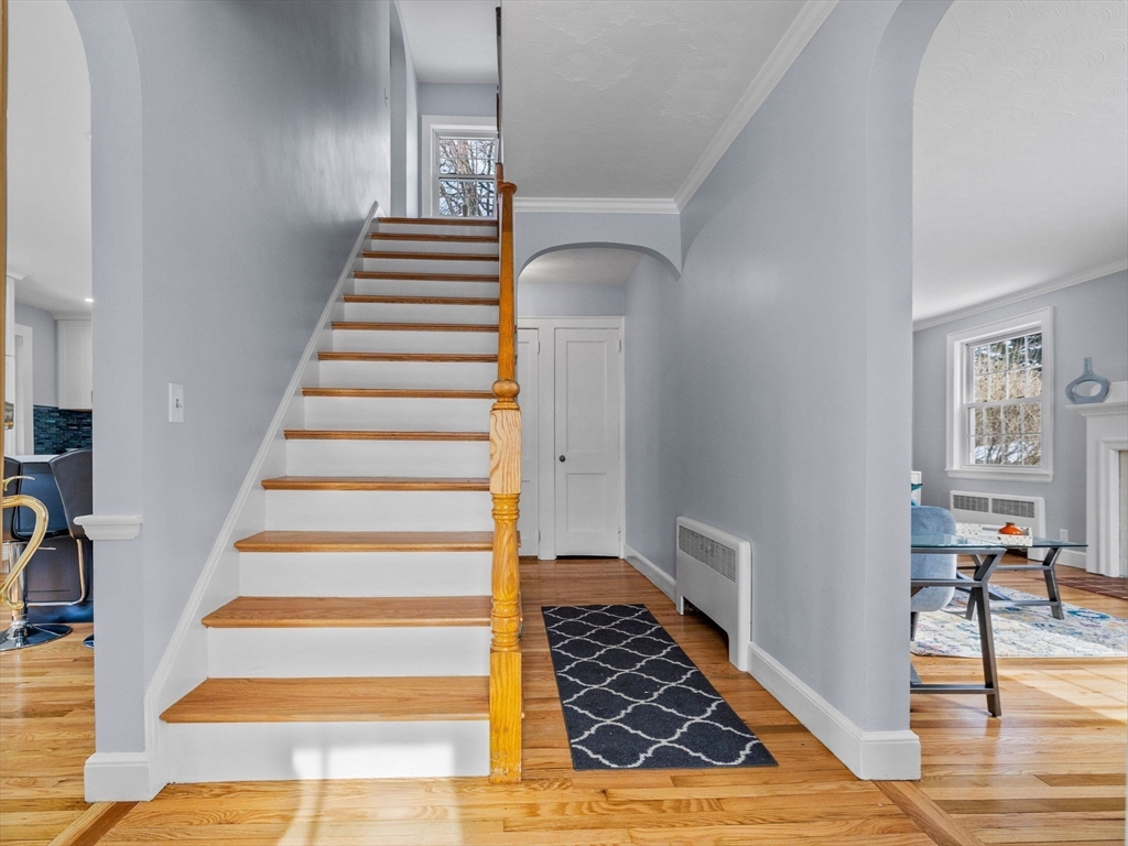 7 Neillian Crescent Boston, MA 02130 - Photo 3 of 29 a view of entryway and hall with wooden floor