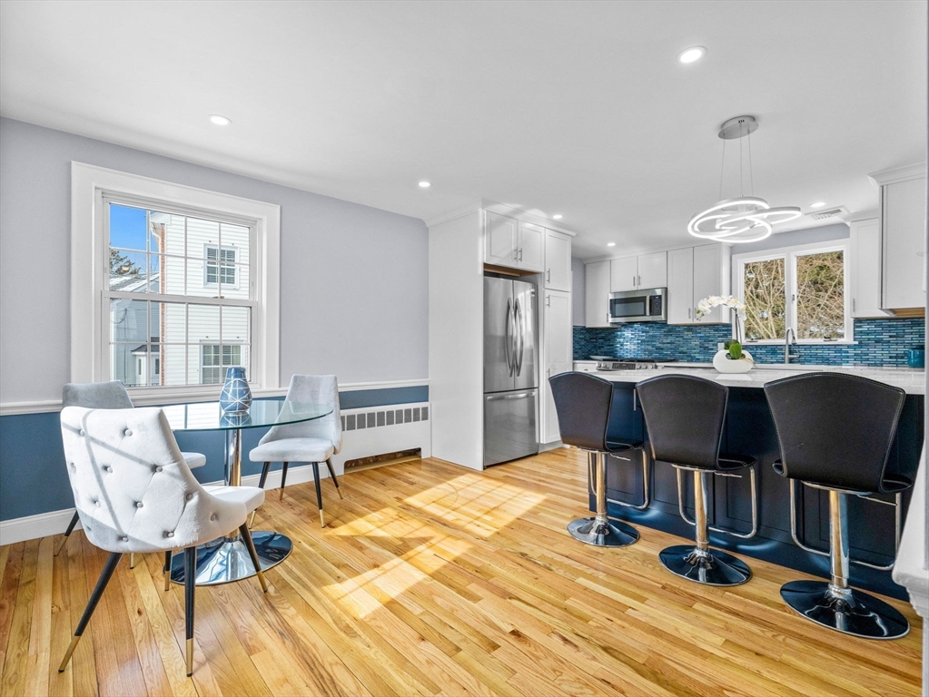 7 Neillian Crescent Boston, MA 02130 - Photo 4 of 29 a view of a dining room with furniture and wooden floor
