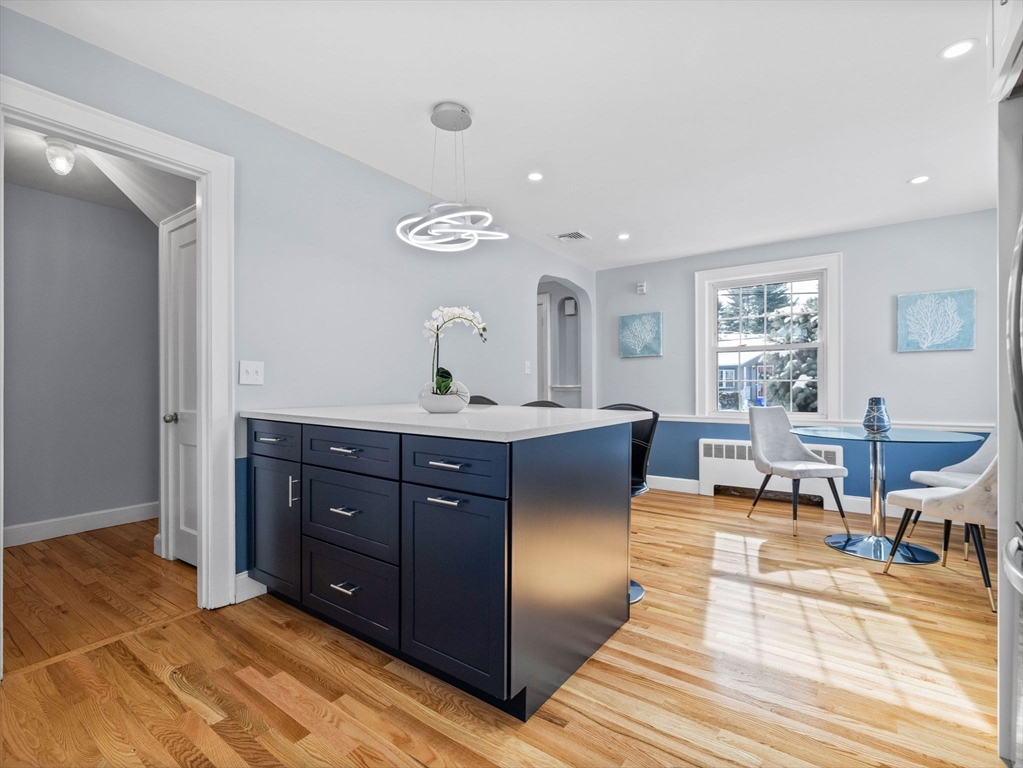 7 Neillian Crescent Boston, MA 02130 - Photo 8 of 29 a living room with furniture and wooden floor