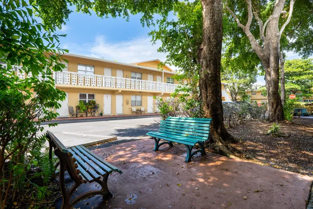 a view of a bench in a backyard