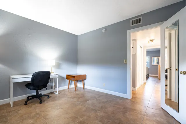 a workspace with furniture and a window