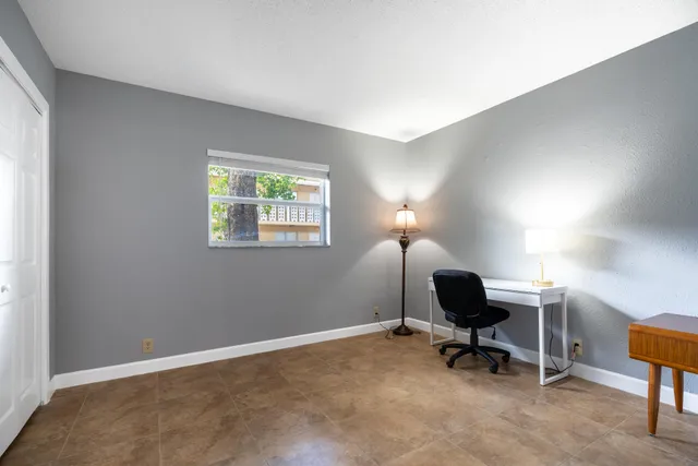 a workspace with furniture and a window