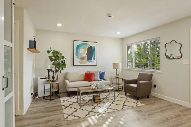 a living room with furniture and window