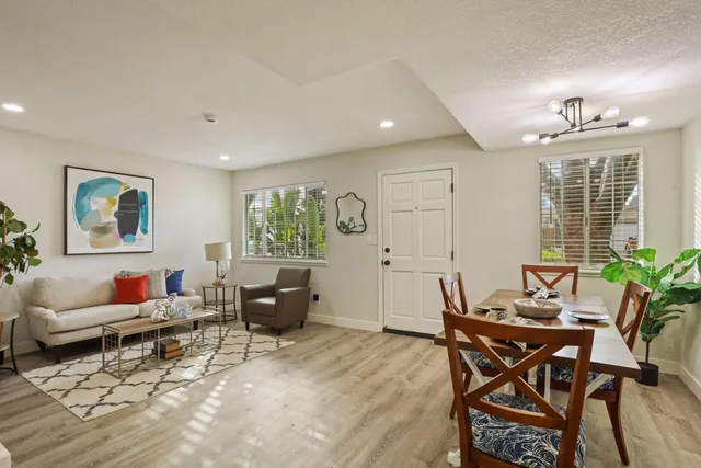 a kitchen with stainless steel appliances granite countertop a sink and a stove