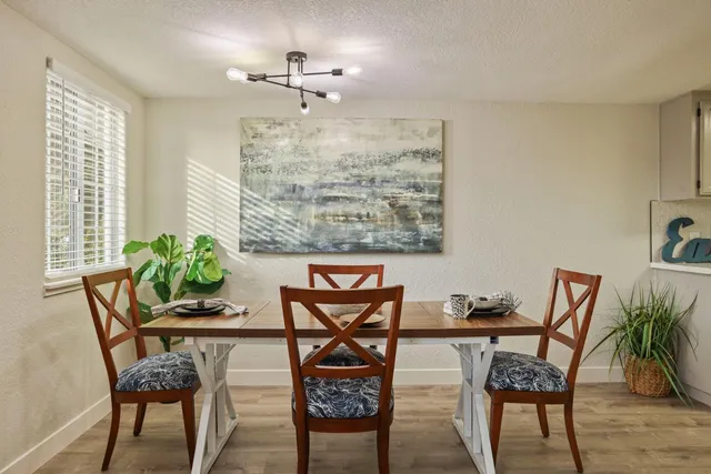 a kitchen with stainless steel appliances granite countertop a sink and a stove