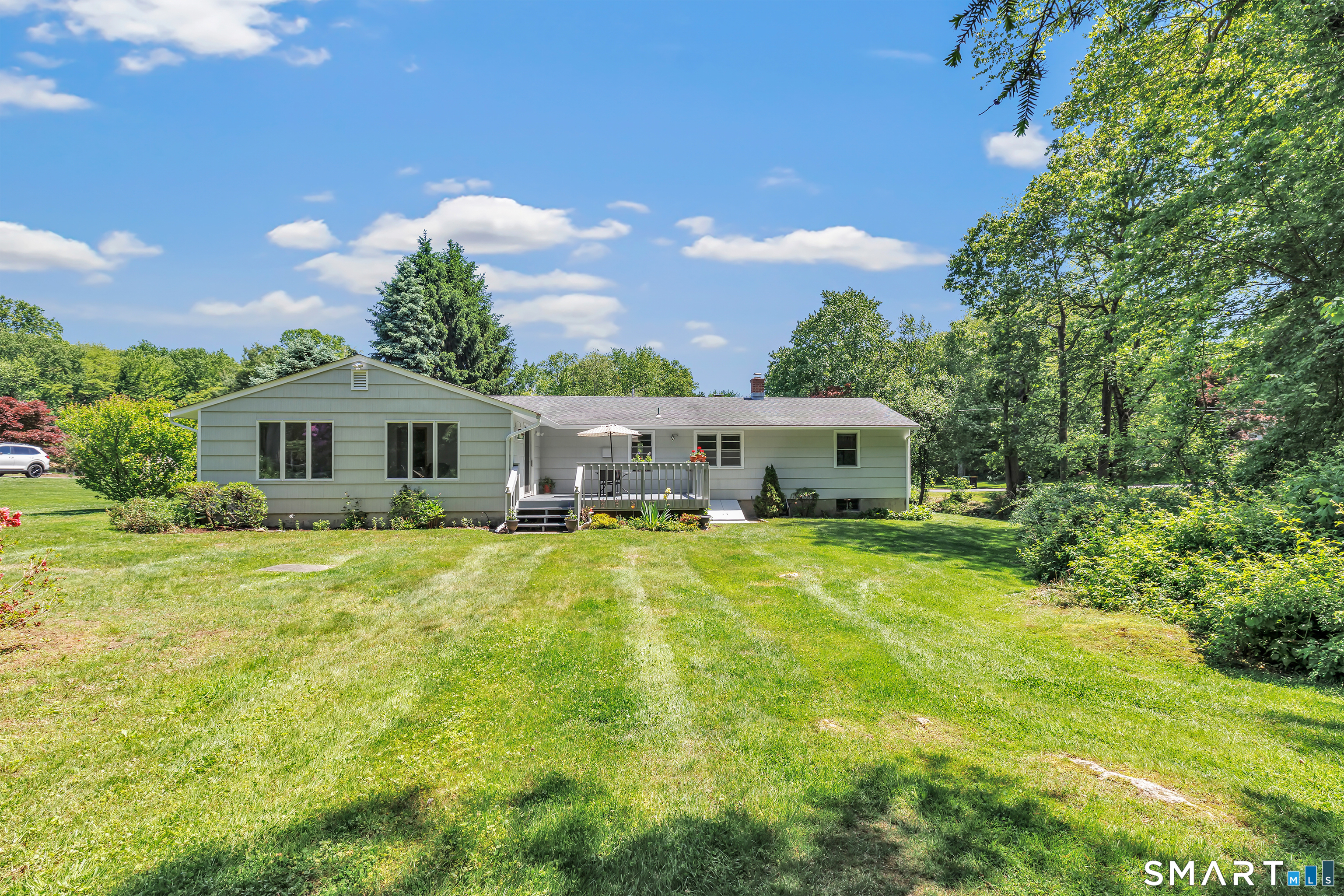 223 Wheeler Road Monroe, CT 06468 - Photo 30 of 35 a front view of a house with a garden