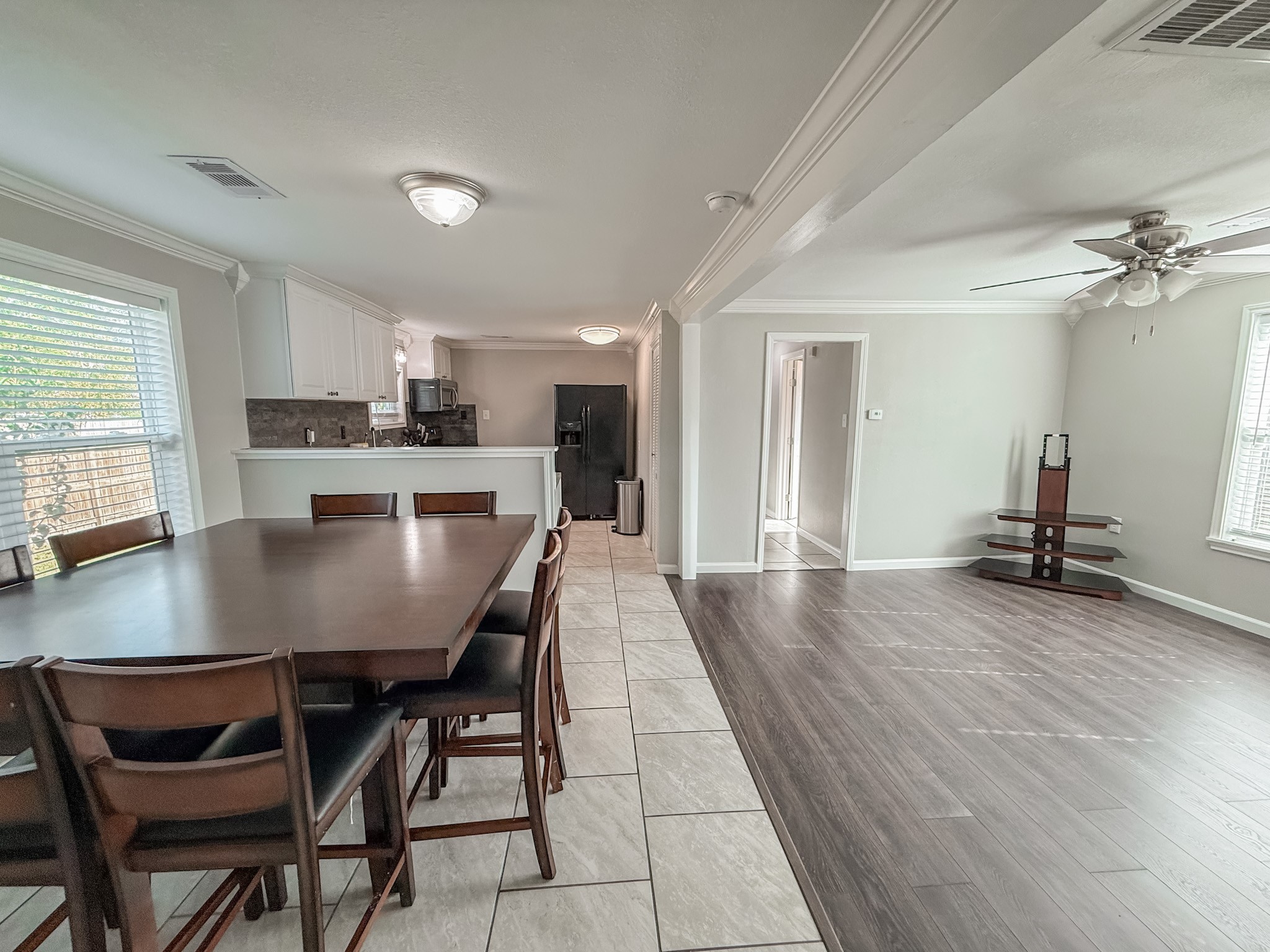 4901 Elm Street Seabrook, TX 77586 - Photo 13 of 32 a view of a dining room with furniture and a large window
