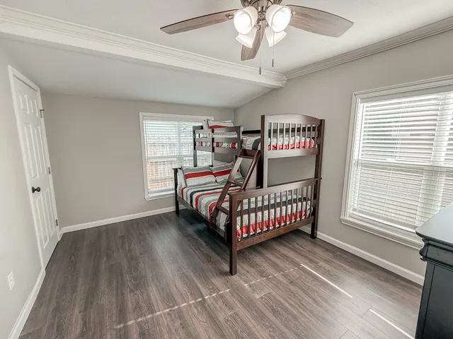 a bedroom with a bed and window