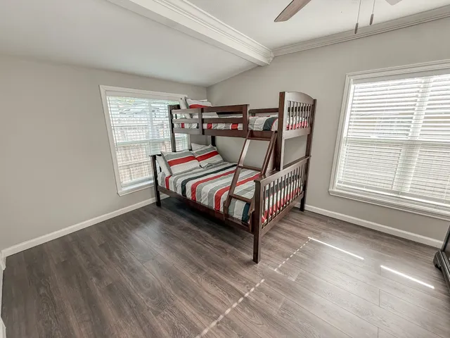 a bedroom with a bed and window