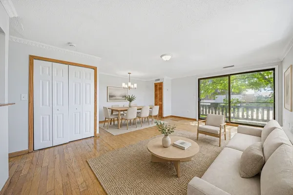 a view of a dining room with furniture window and wooden floor