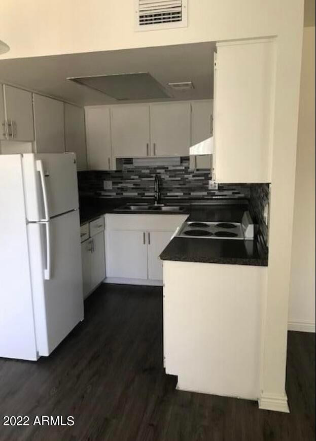 2021 West Hayward Avenue, Unit 11 Phoenix, AZ 85021 - Photo 7 of 14 a kitchen with a refrigerator and a stove
