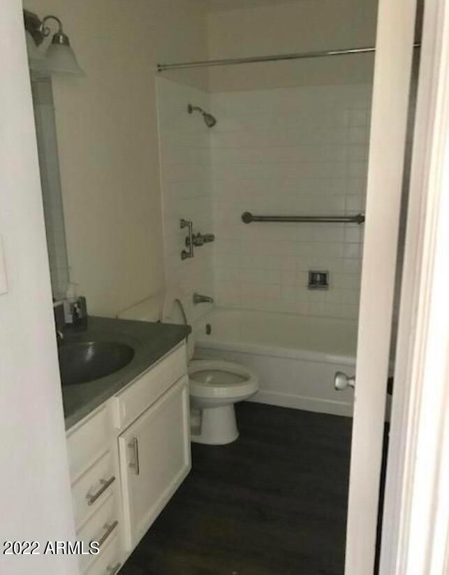 2021 West Hayward Avenue, Unit 11 Phoenix, AZ 85021 - Photo 10 of 14 a bathroom with a granite countertop sink a toilet and shower