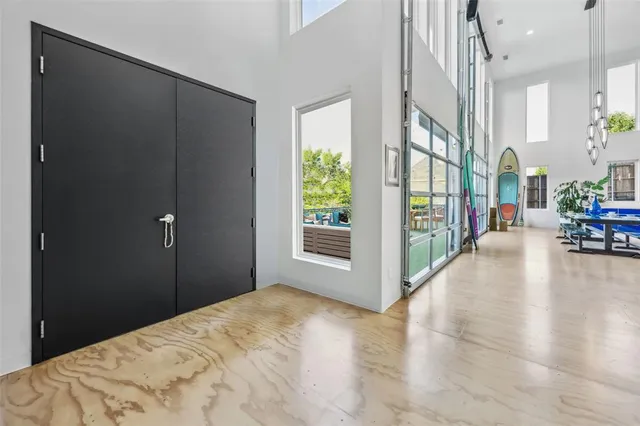 a view of a big room with windows and stairs