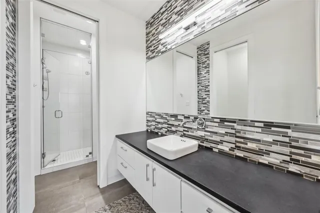 a bed room with a bed and a painting on the wall