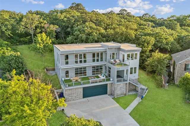 a front view of a house with a yard table and chairs