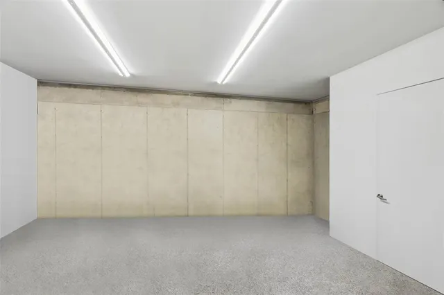 a view of a patio with couches potted plants and a big yard