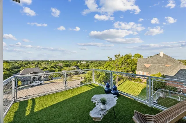 a front view of a house with a garden and sitting area