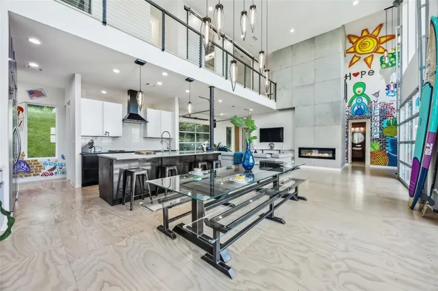 a living room with fireplace furniture and a flat screen tv