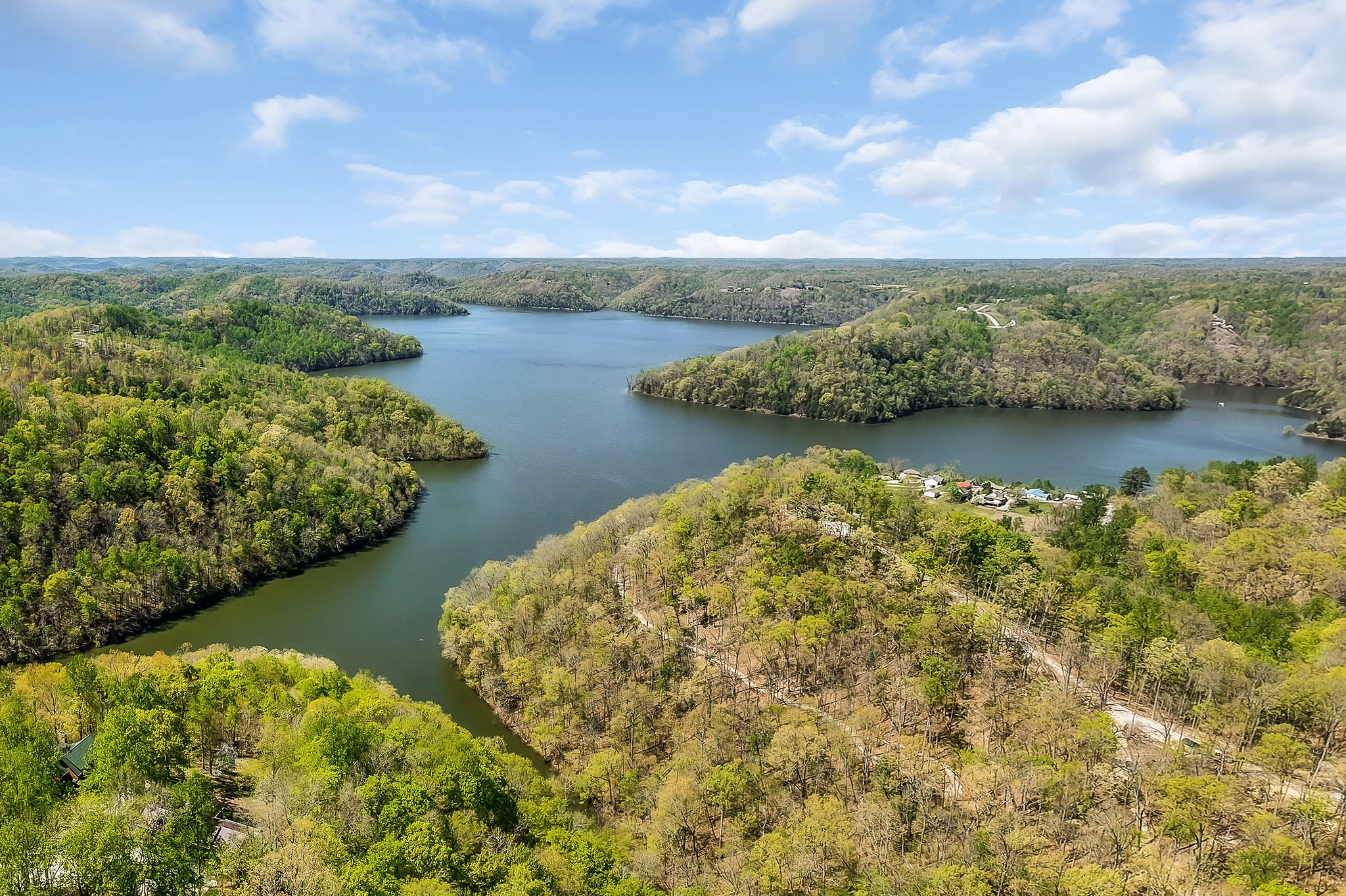 27 Poplar Point Road Sparta, TN 38583 - Photo 6 of 6 a view of a lake with houses in the back