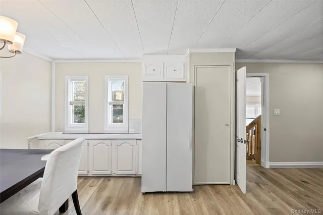 a view of room with window and hardwood floor