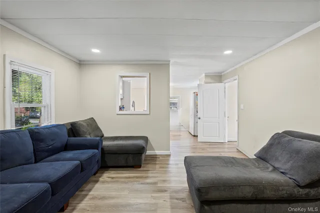 a bedroom with a bed and a television