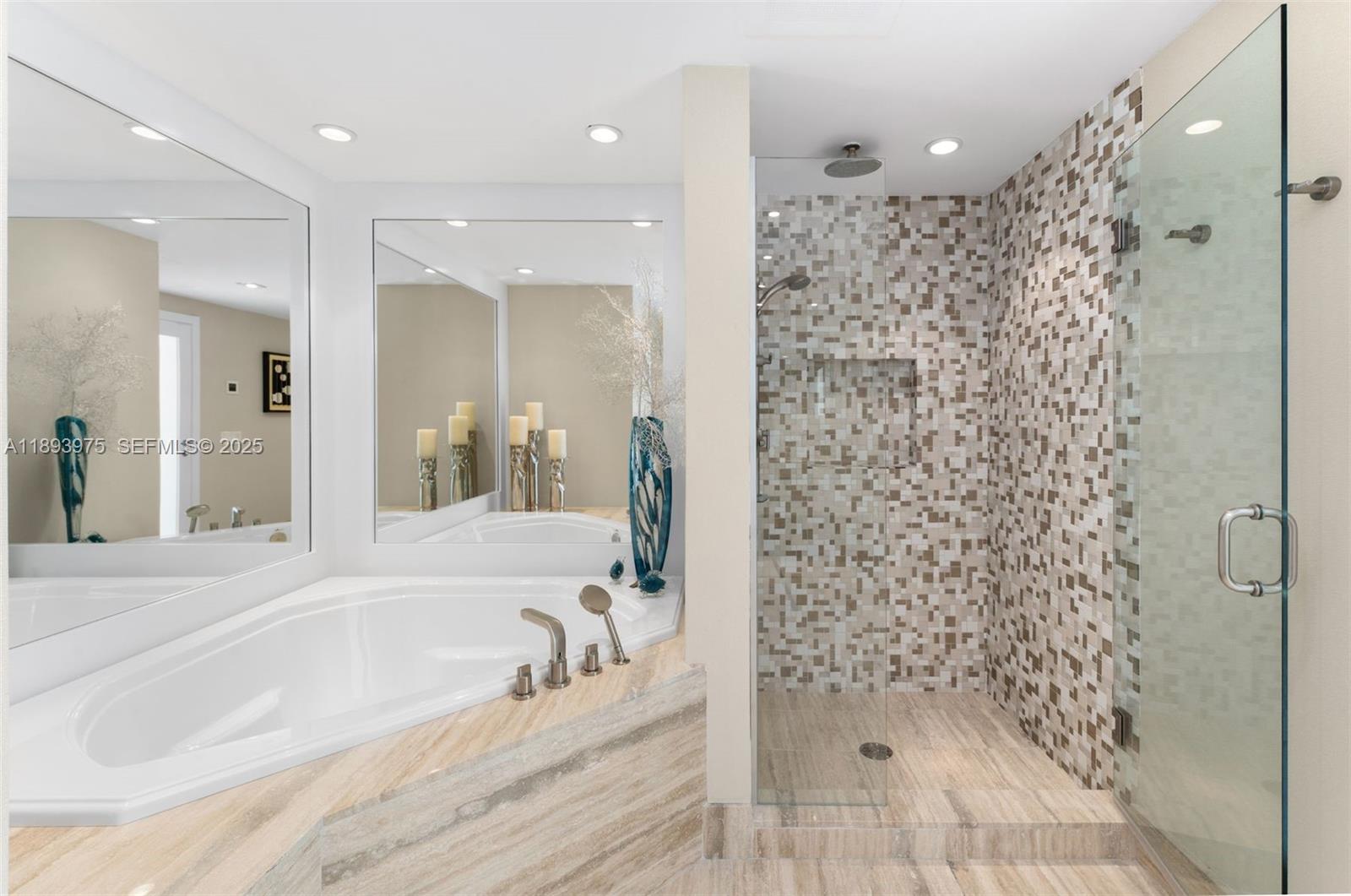 6899 Collins Avenue, Unit LPH04 Miami Beach, FL 33141 - Photo 16 of 29 a bathroom with a bathtub and a shower