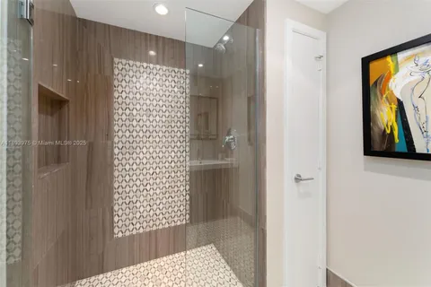 a spacious bedroom with a large bed and a tv