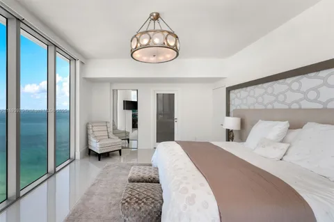 a bathroom with a tub sink shower and mirror