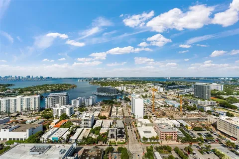 a view of residential houses with outdoor space