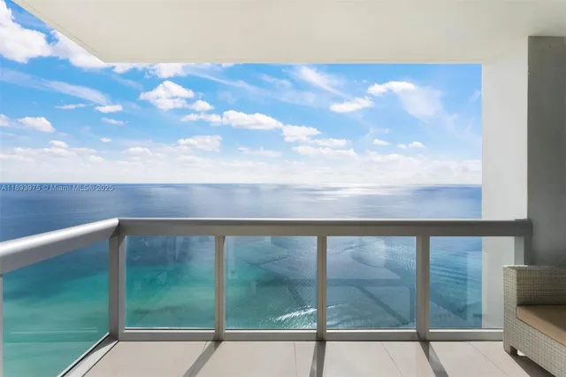 a view of a balcony with furniture