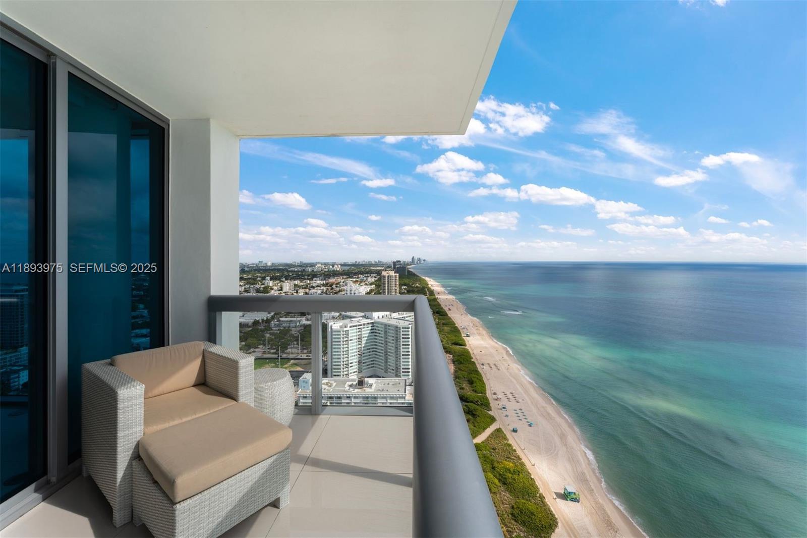 6899 Collins Avenue, Unit LPH04 Miami Beach, FL 33141 - Photo 9 of 29 a view of a balcony with furniture