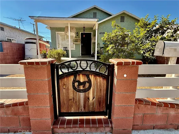 a front view of a house with parking area