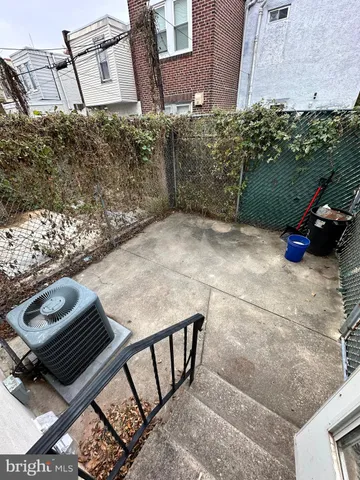 a view of barbeque area with seating