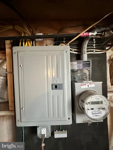 a close view of water heater and a refrigerator in a kitchen
