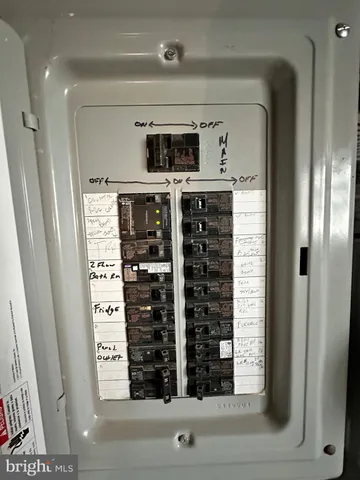 a bathroom with a shower and mirror