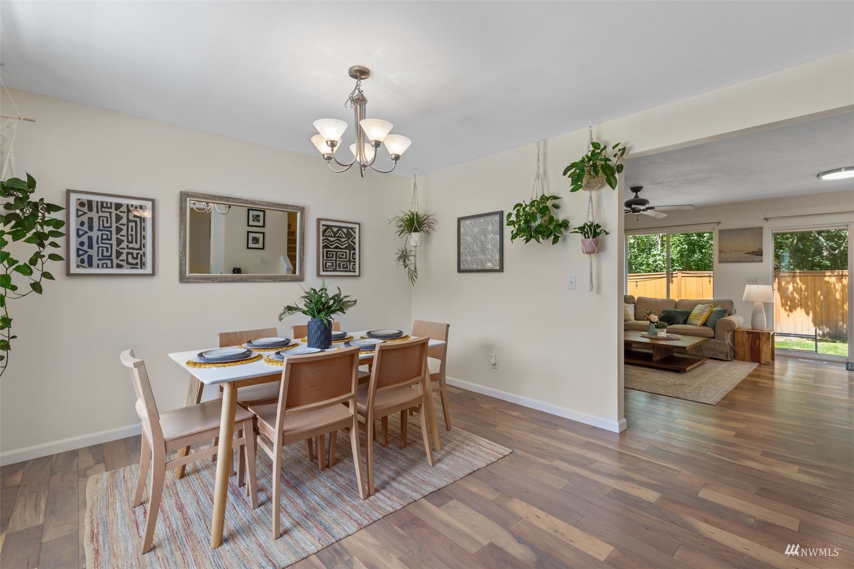 2321 Stafford Way Bothell, WA 98012 - Photo 2 of 38 a view of a dining room with furniture a chandelier and wooden floor