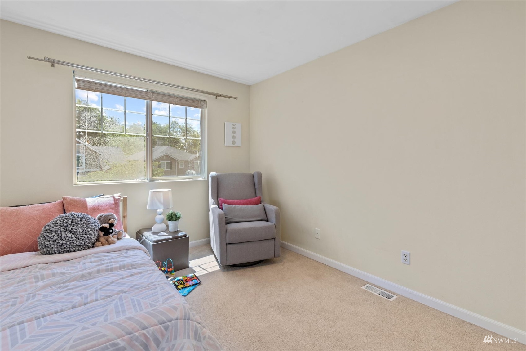 2321 Stafford Way Bothell, WA 98012 - Photo 25 of 38 a bedroom with a bed and wooden floor