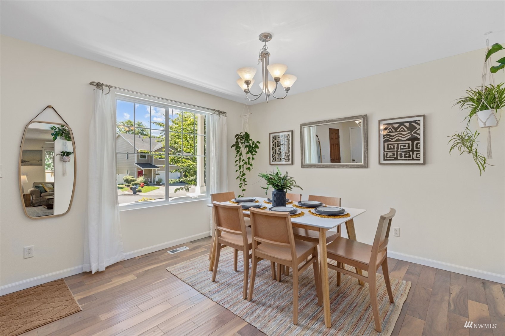 2321 Stafford Way Bothell, WA 98012 - Photo 3 of 38 a view of a dining room with furniture window and wooden floor