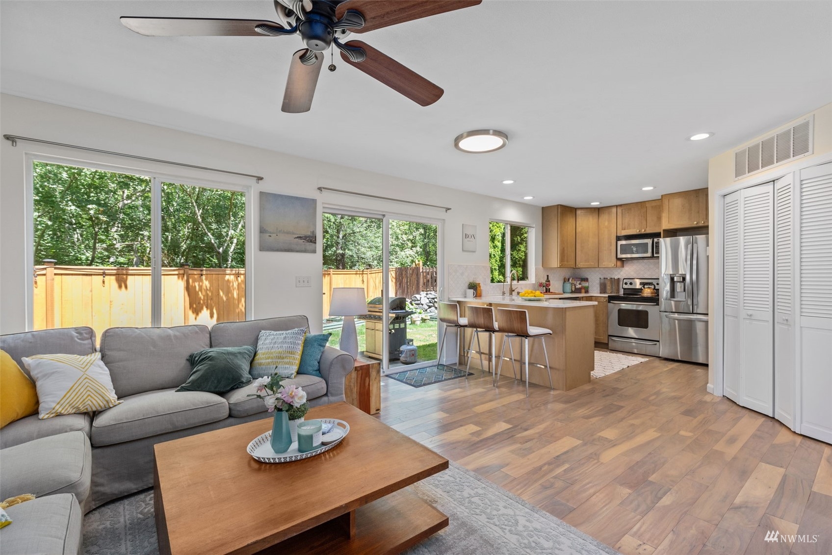 2321 Stafford Way Bothell, WA 98012 - Photo 7 of 38 a living room with furniture kitchen view and a large window