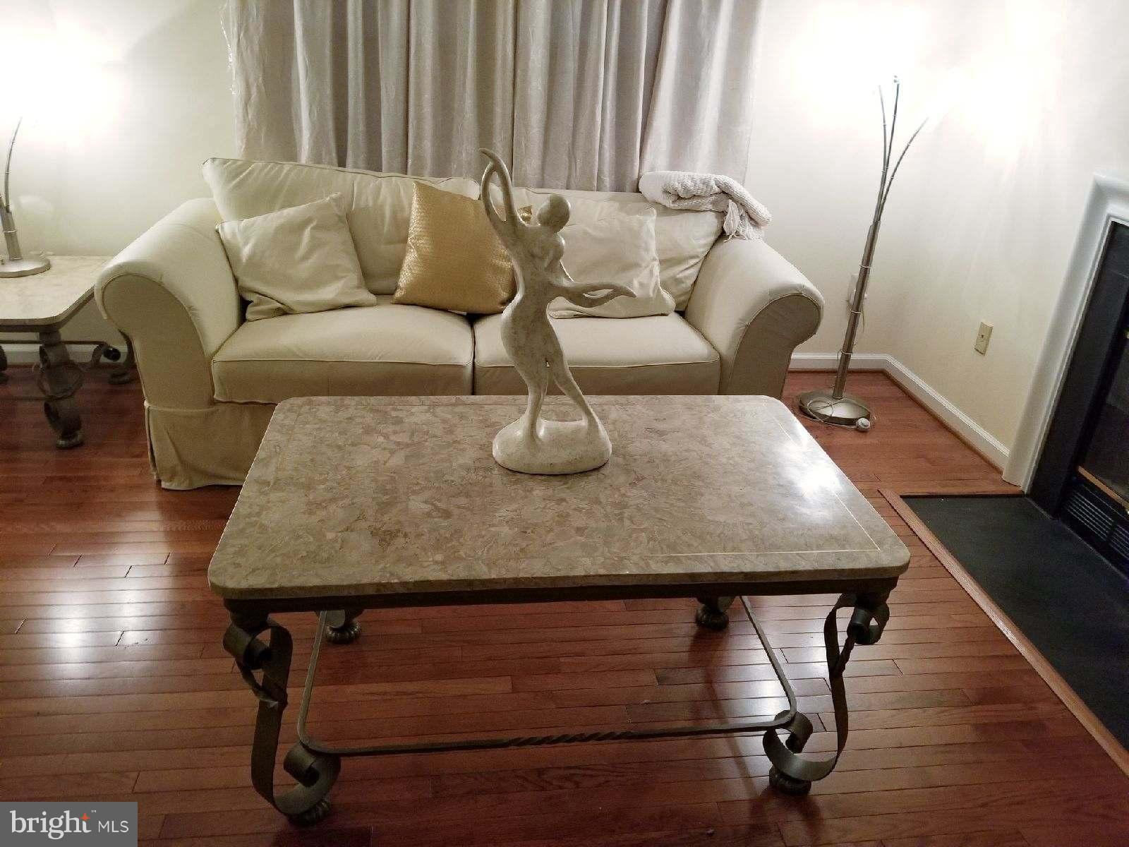 1101 Marksworth Road Baltimore, MD 21207 - Photo 6 of 29 a living room with furniture and wooden floor