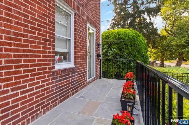 a view of a balcony with two plants