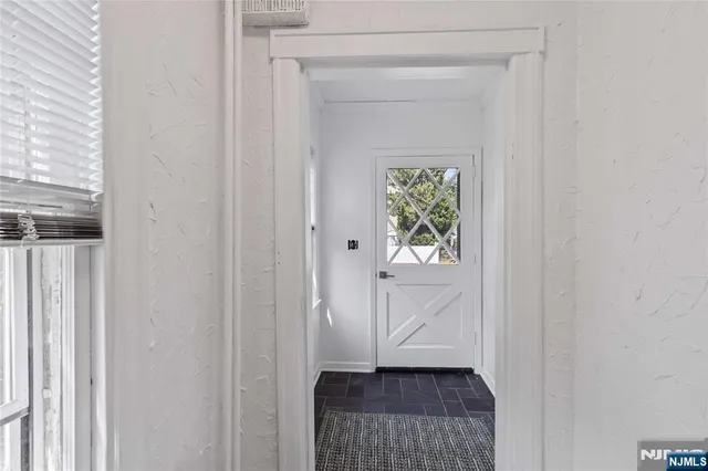 a view of entryway with wooden floor