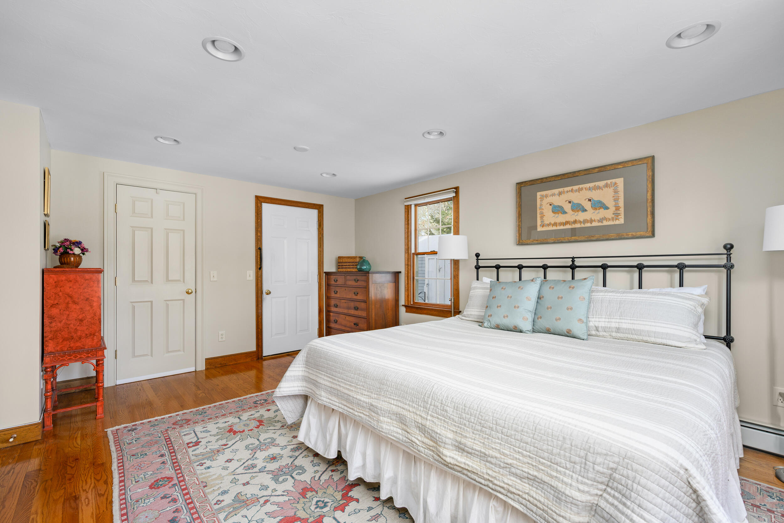 36 Island Street East Dennis, MA 02660 - Photo 14 of 41 a spacious bedroom with a bed and wooden floor