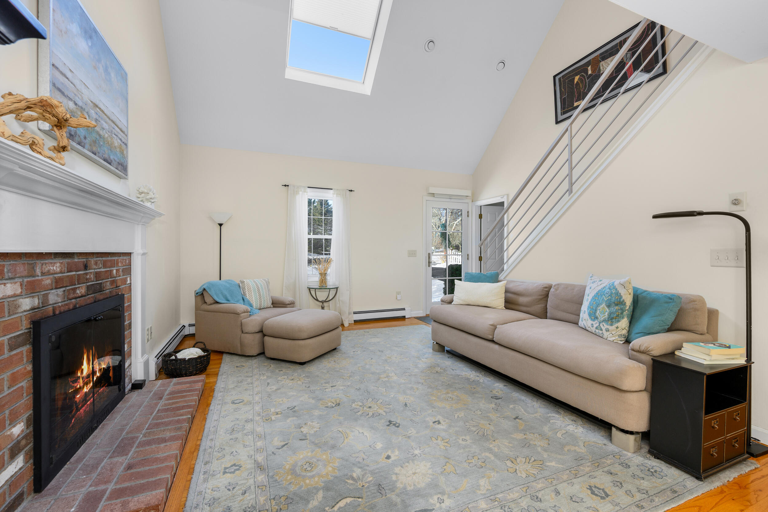 36 Island Street East Dennis, MA 02660 - Photo 16 of 41 a living room with furniture and a fireplace