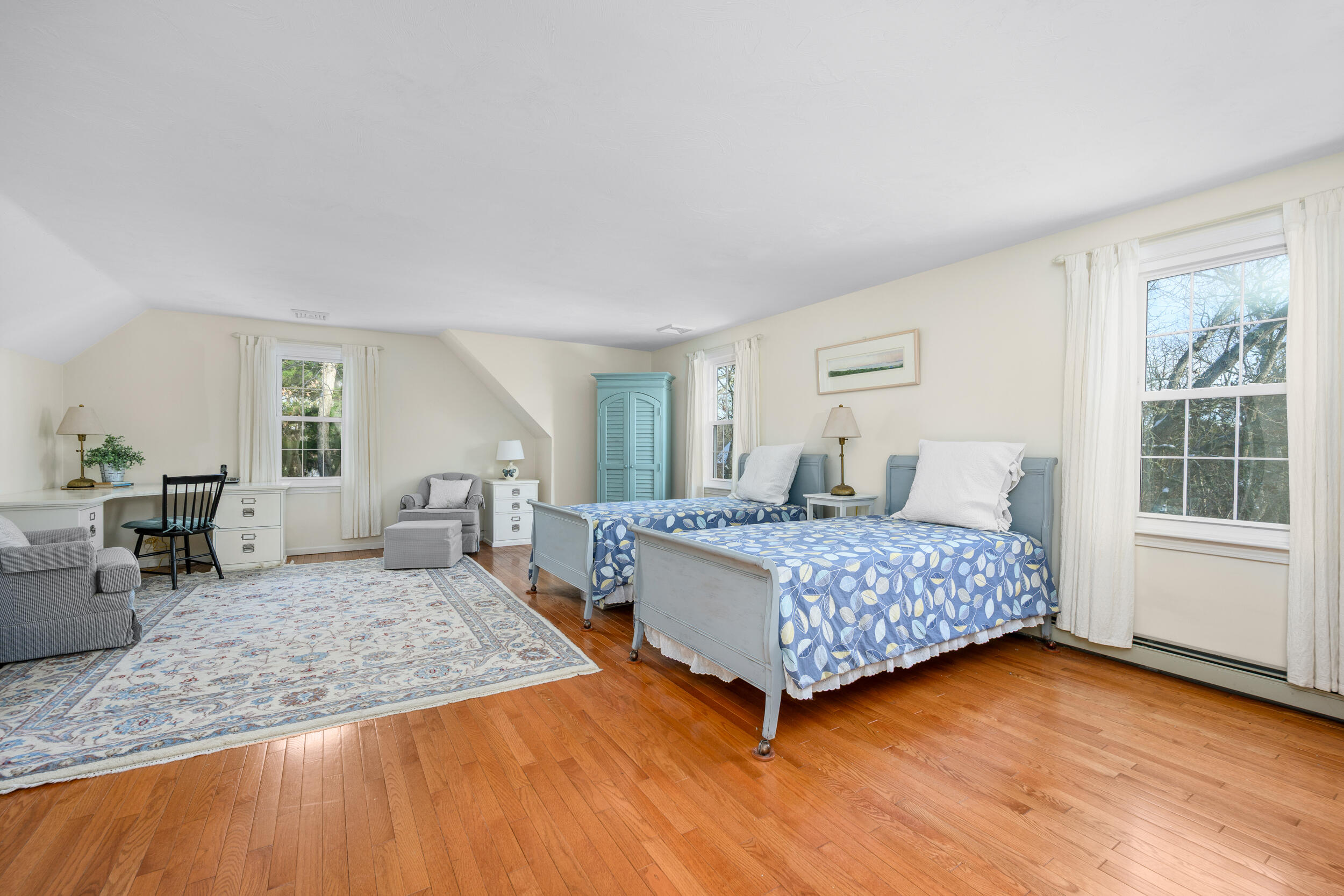 36 Island Street East Dennis, MA 02660 - Photo 17 of 41 a bedroom with a large bed a rug and two large window