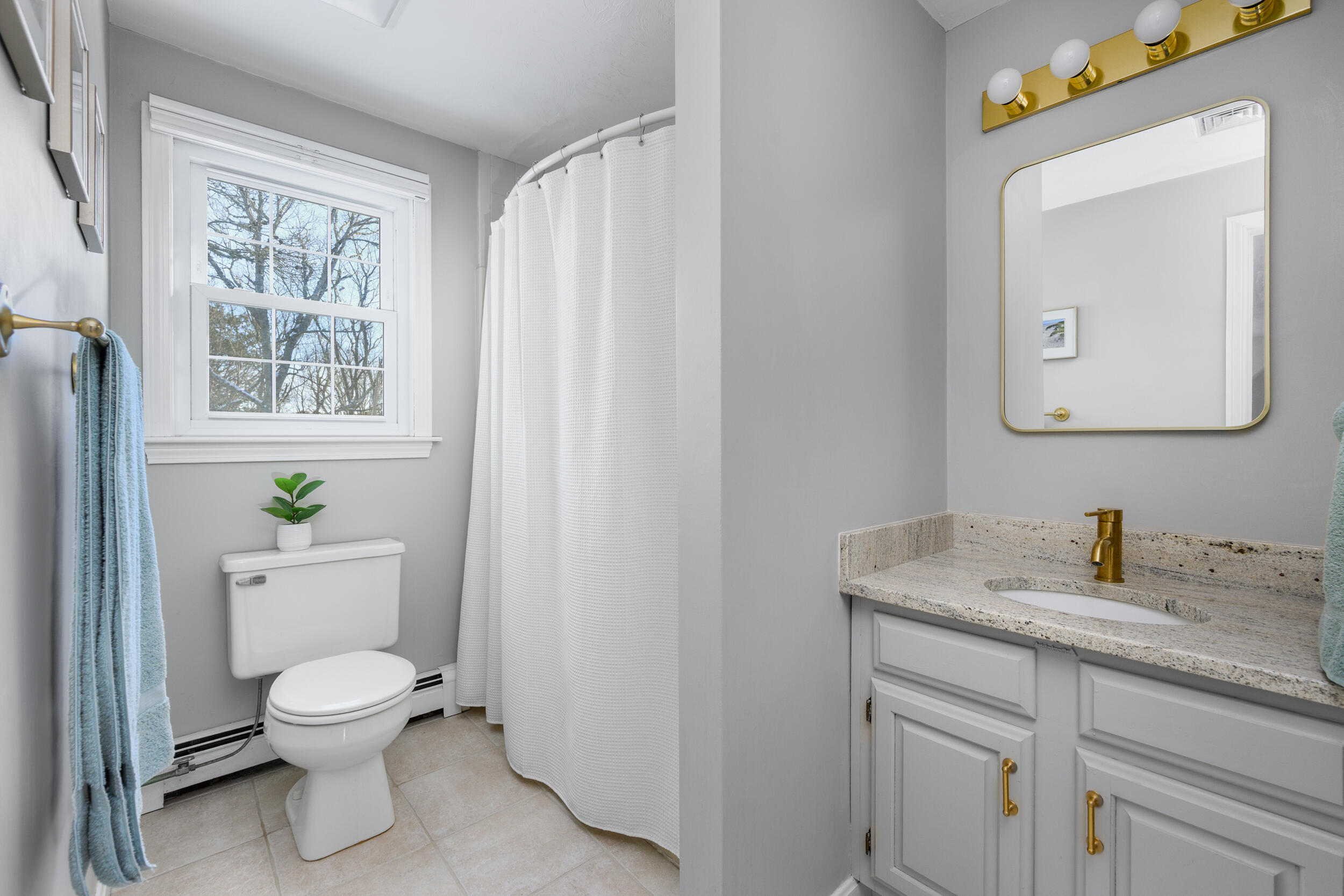 36 Island Street East Dennis, MA 02660 - Photo 20 of 41 a bathroom with a toilet a sink and a mirror