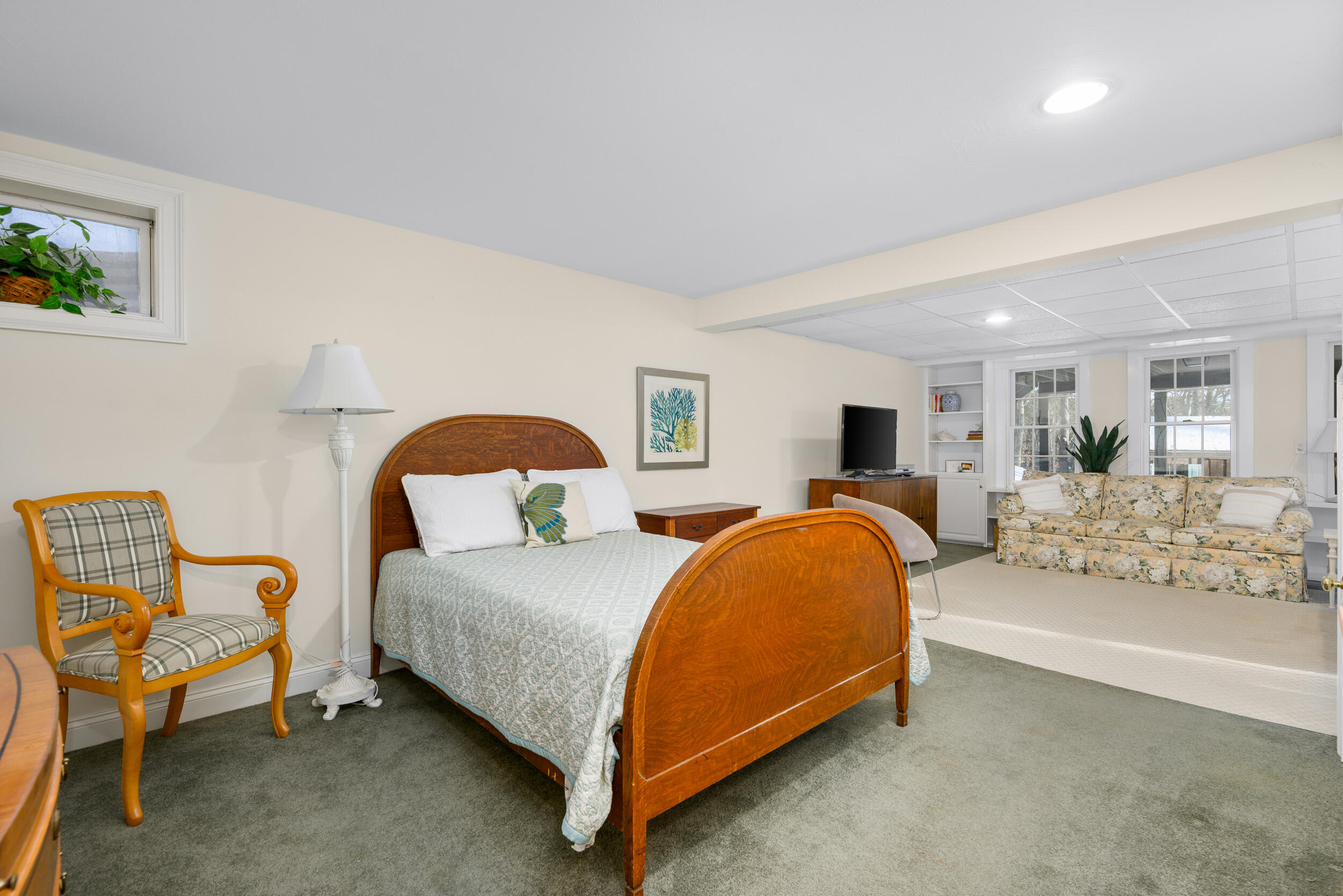 36 Island Street East Dennis, MA 02660 - Photo 24 of 41 a spacious bedroom with a bed and window
