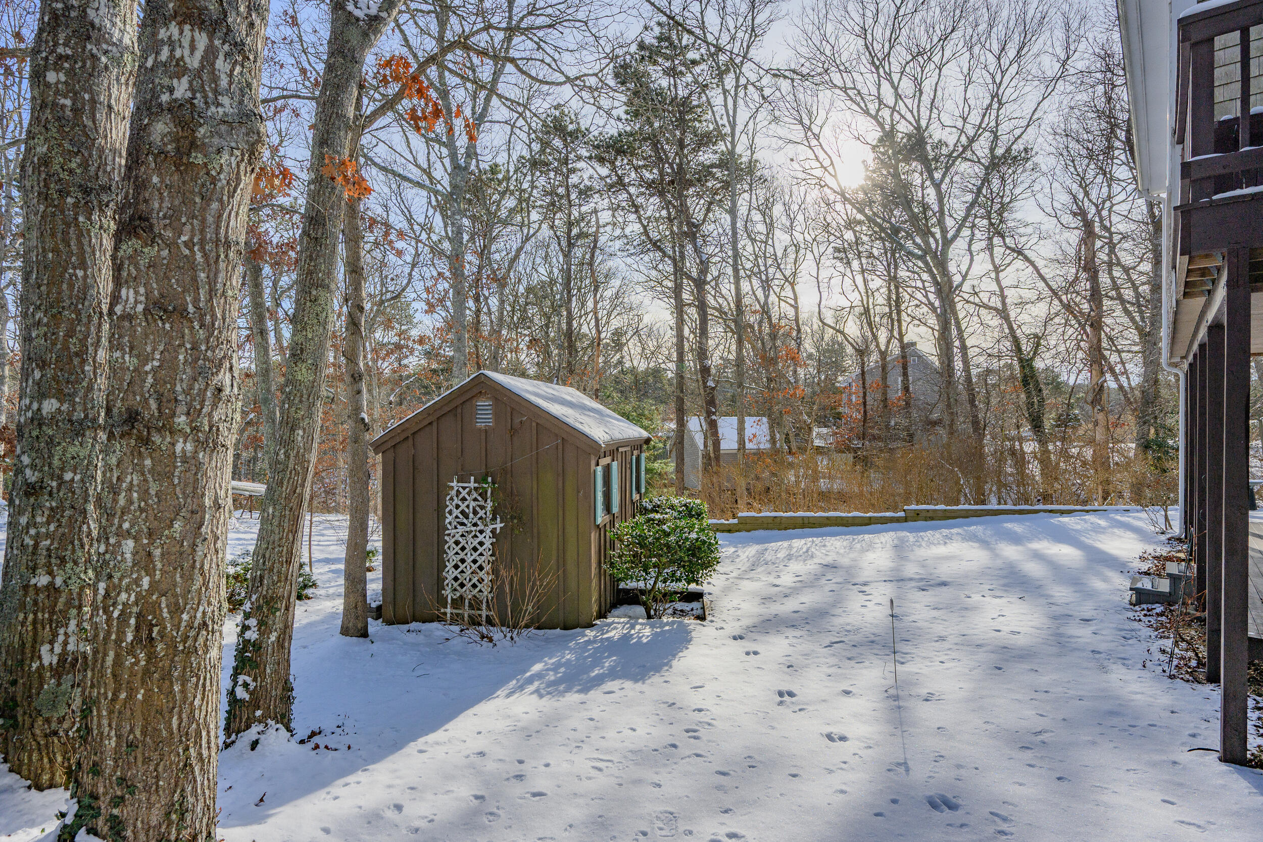 36 Island Street East Dennis, MA 02660 - Photo 34 of 41 a front view of a house with a yard and garage
